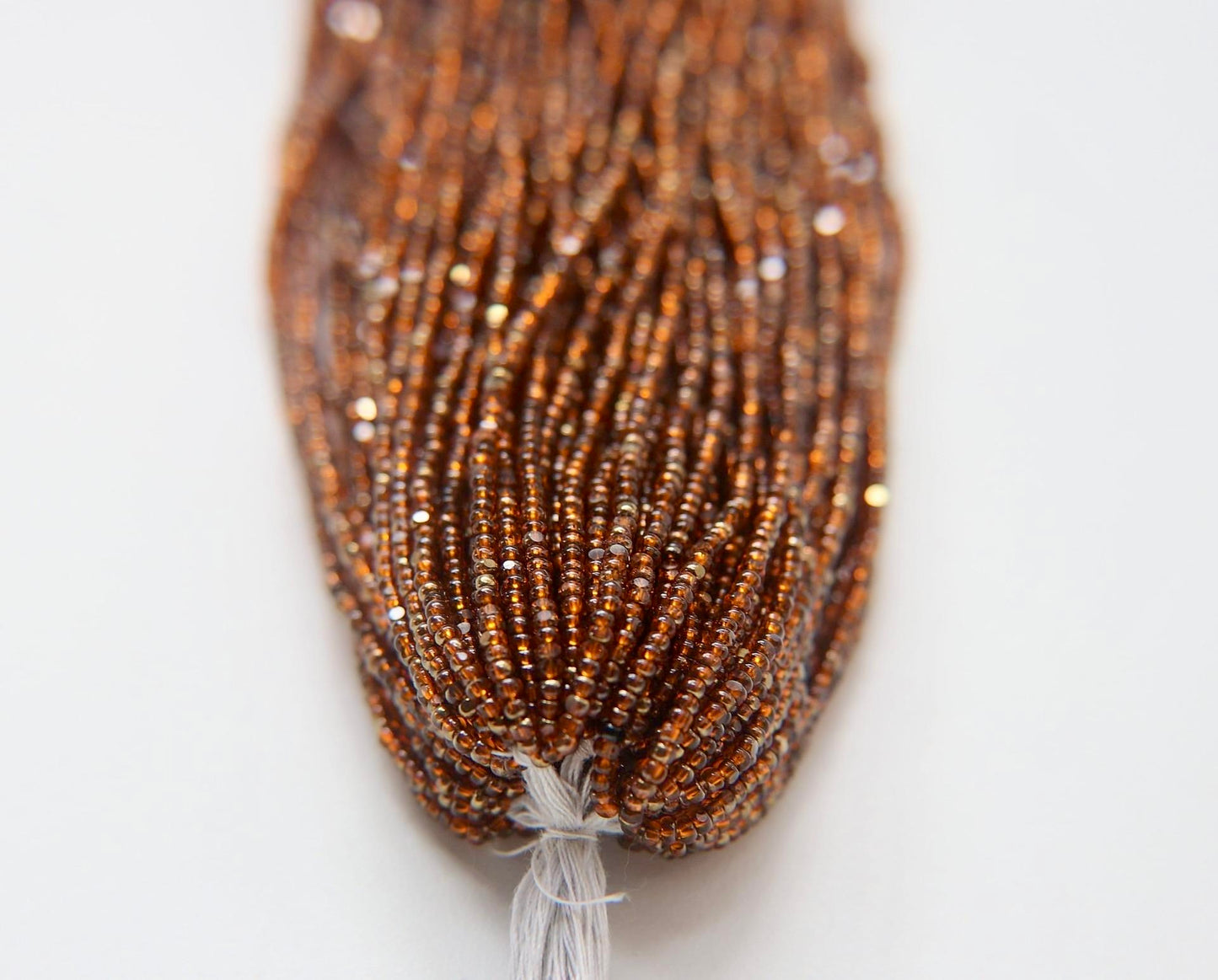 Patina Transparent Light Orange Aurum - Sheen 2 Cut Charlotte Cut Beads (11/0)