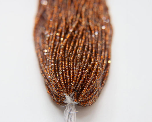 Patina Transparent Light Orange Aurum - Sheen 2 Cut Charlotte Cut Beads (11/0)